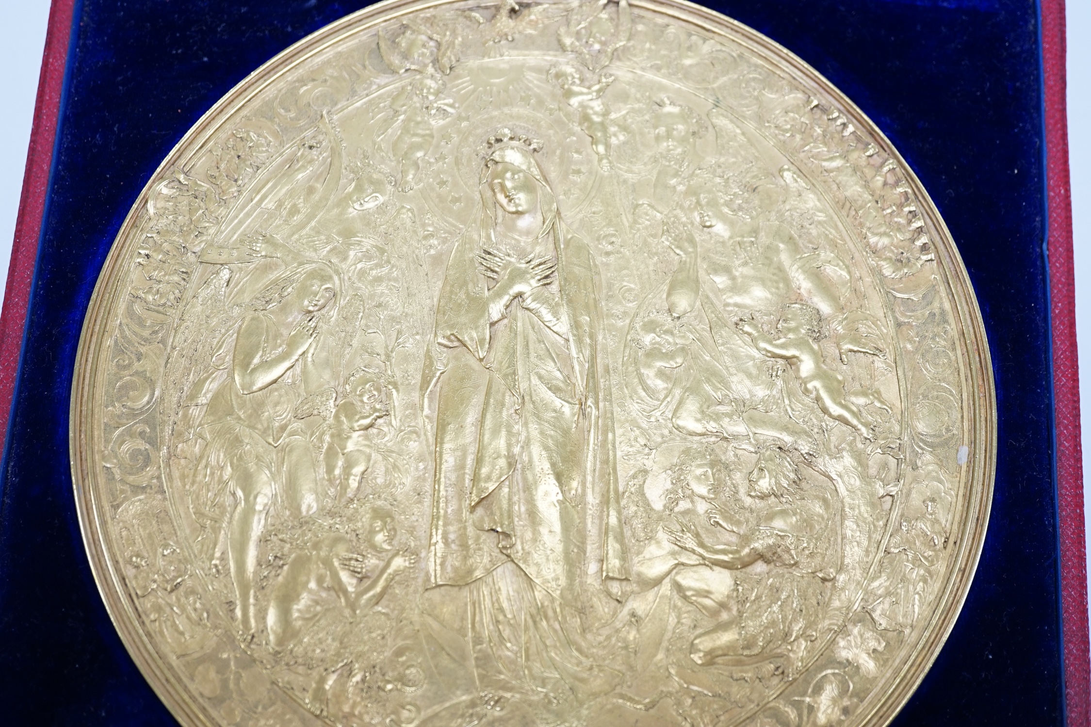 A Victorian pressed metal ormolu medallion of Mary as Queen of Heaven, 15.5cm, in a Hunt & Roskell fitted box